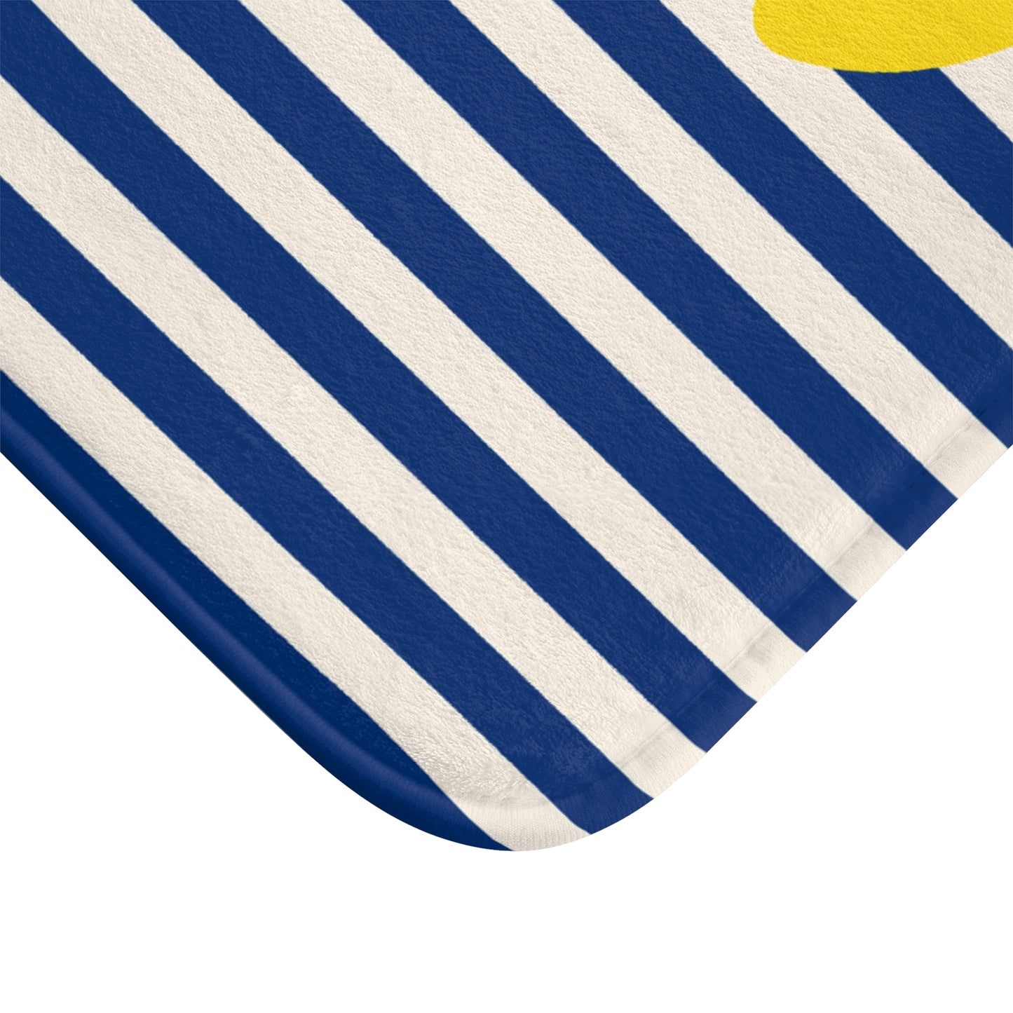 Close-up of a blue and white striped fabric with a yellow corner.