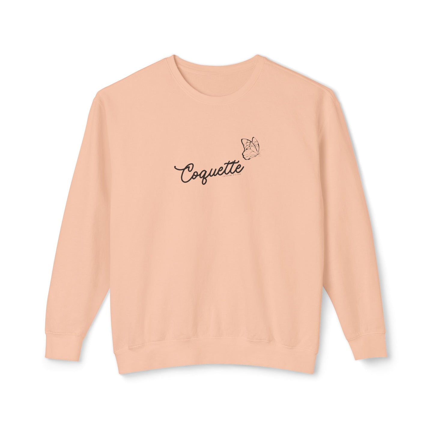 Pink sweatshirt with 'Coquette' text on a white background