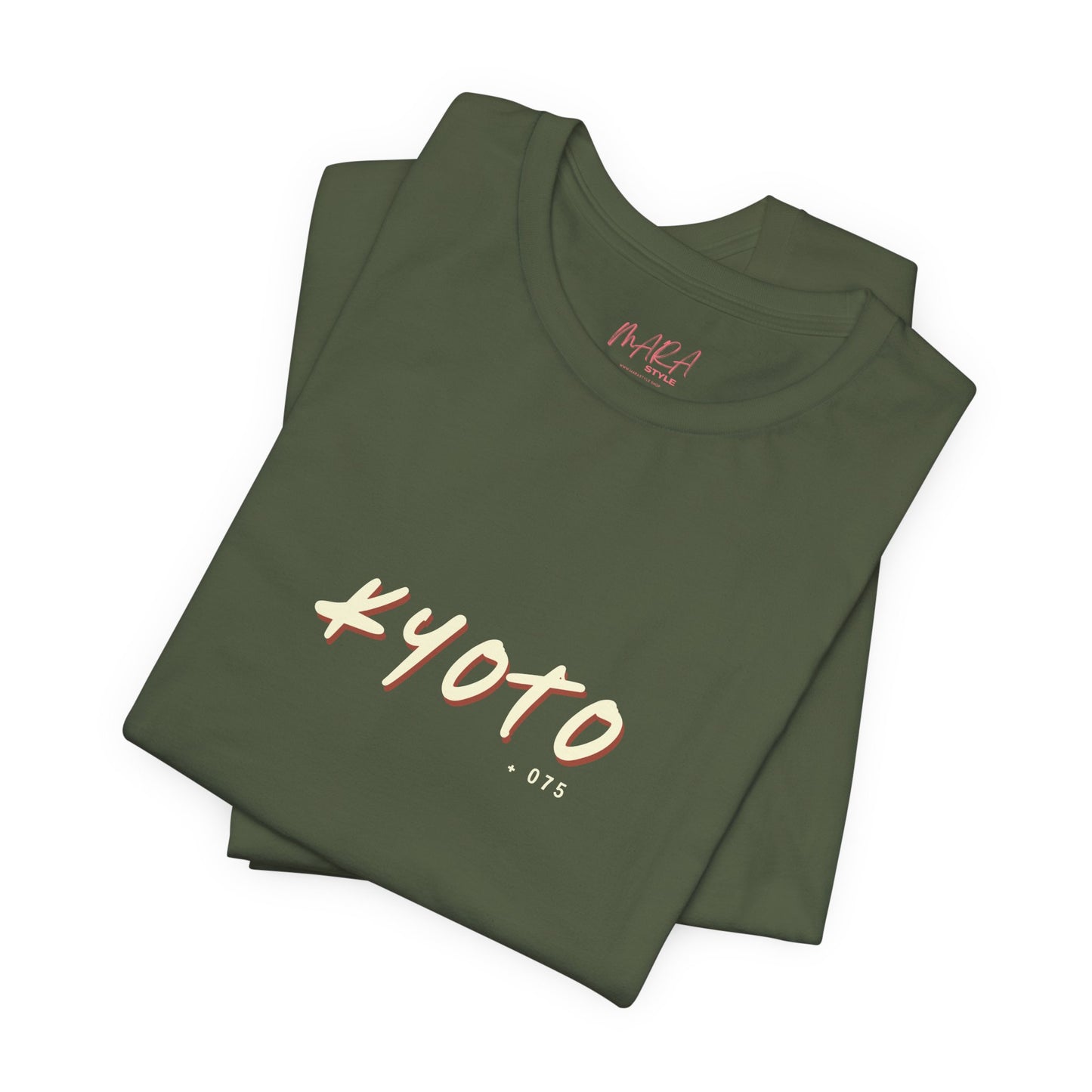 Folded green t-shirt with 'Kyoto 075' print on a white background