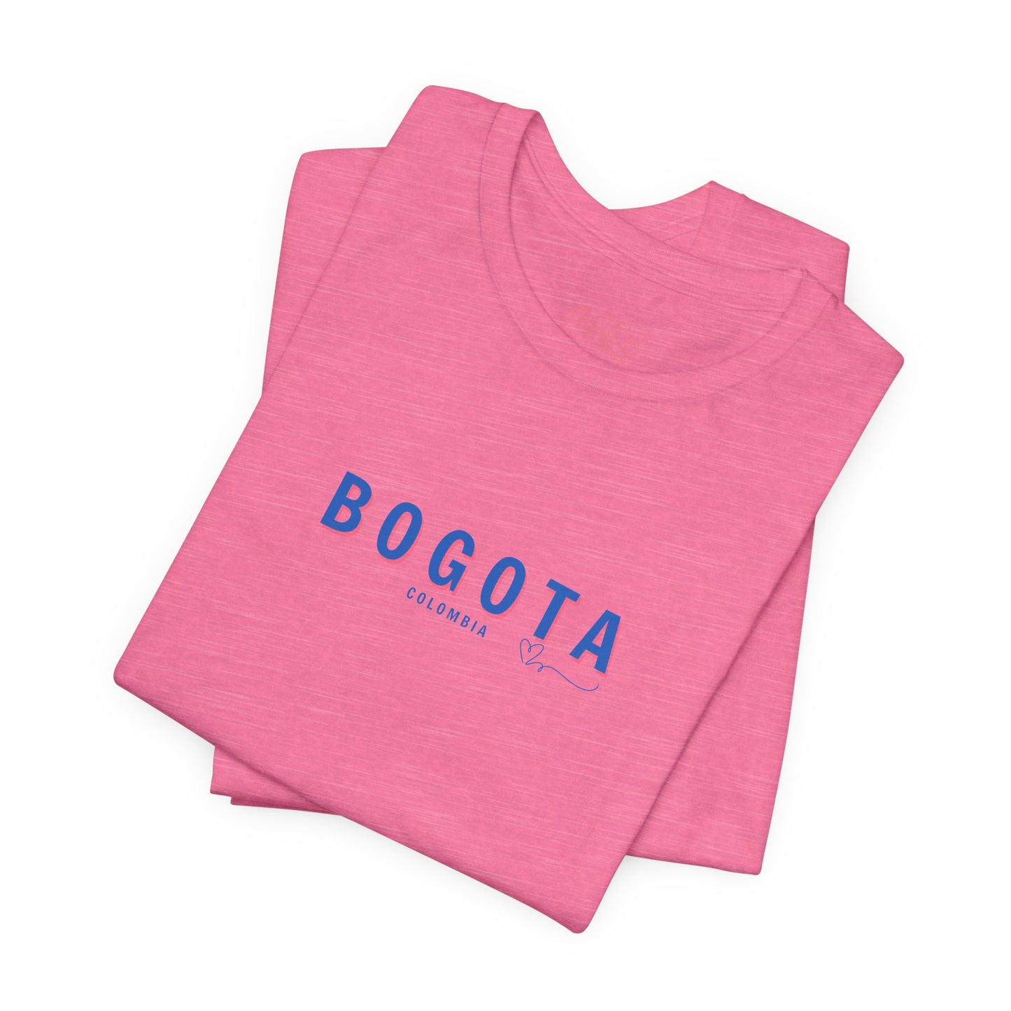 A pink Bogota unisex t-shirt with the word 'BOGOTA' written in blue letters across the front.
