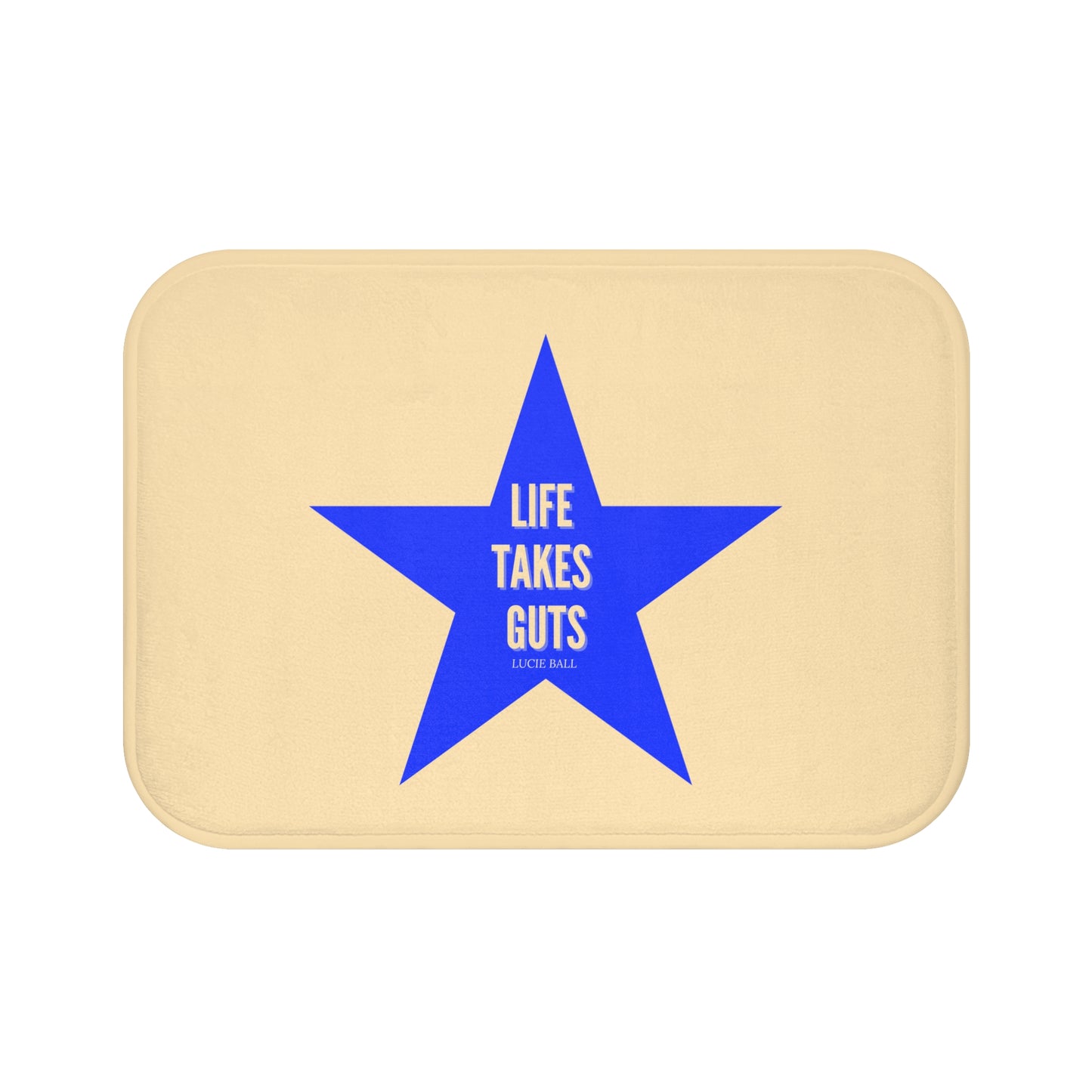 Beige BATH mat with a blue star and Lucille Ball quote text on a white background