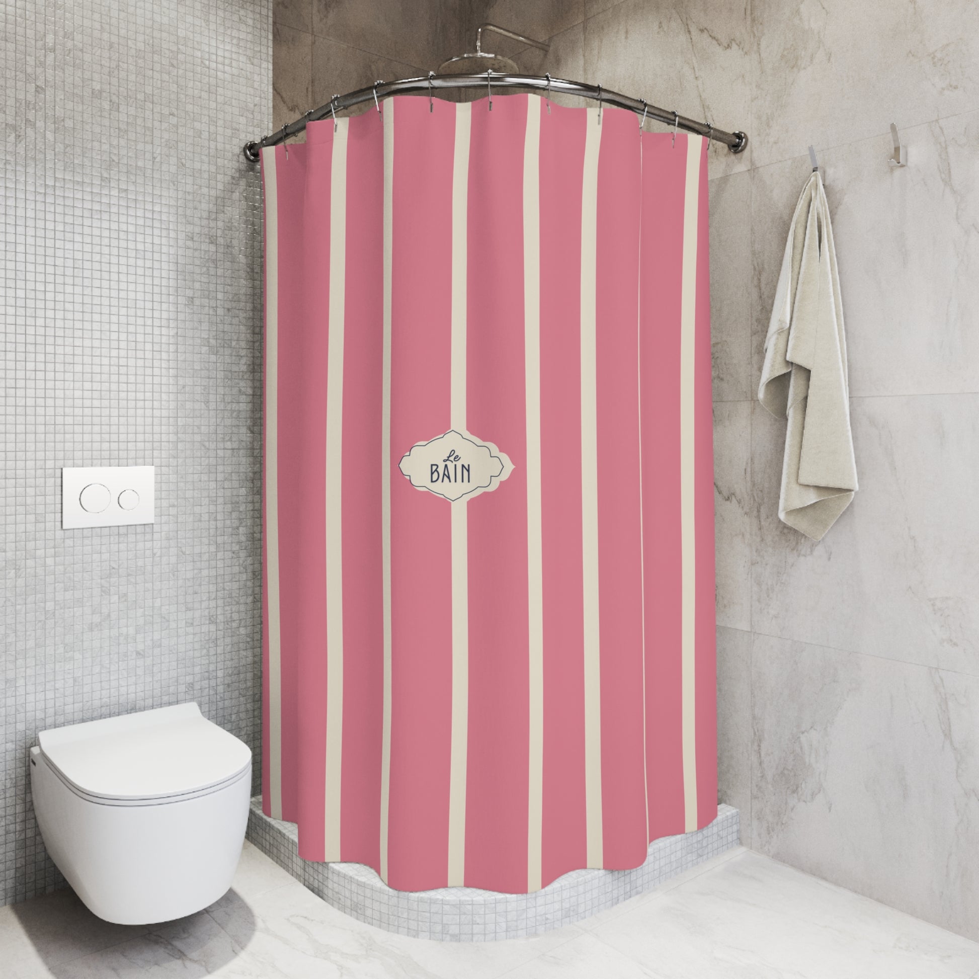 Pink and cream vertical striped shower curtain in a modern tiled bathroom, featuring a central decorative label that reads 'BATH'.