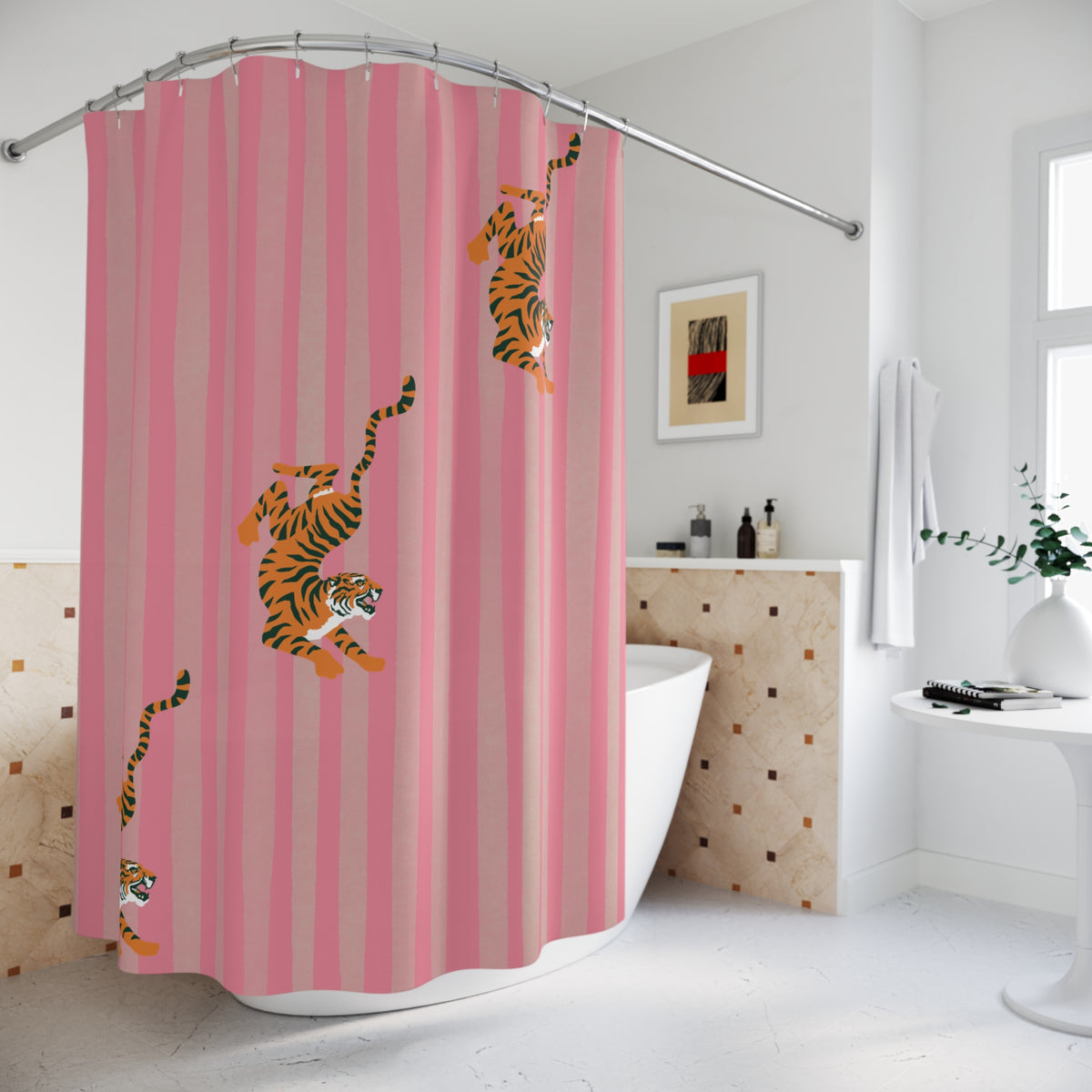A pink shower curtain with vertical stripes and cartoon tiger illustrations, hanging in a bright white bathroom next to a bathtub.