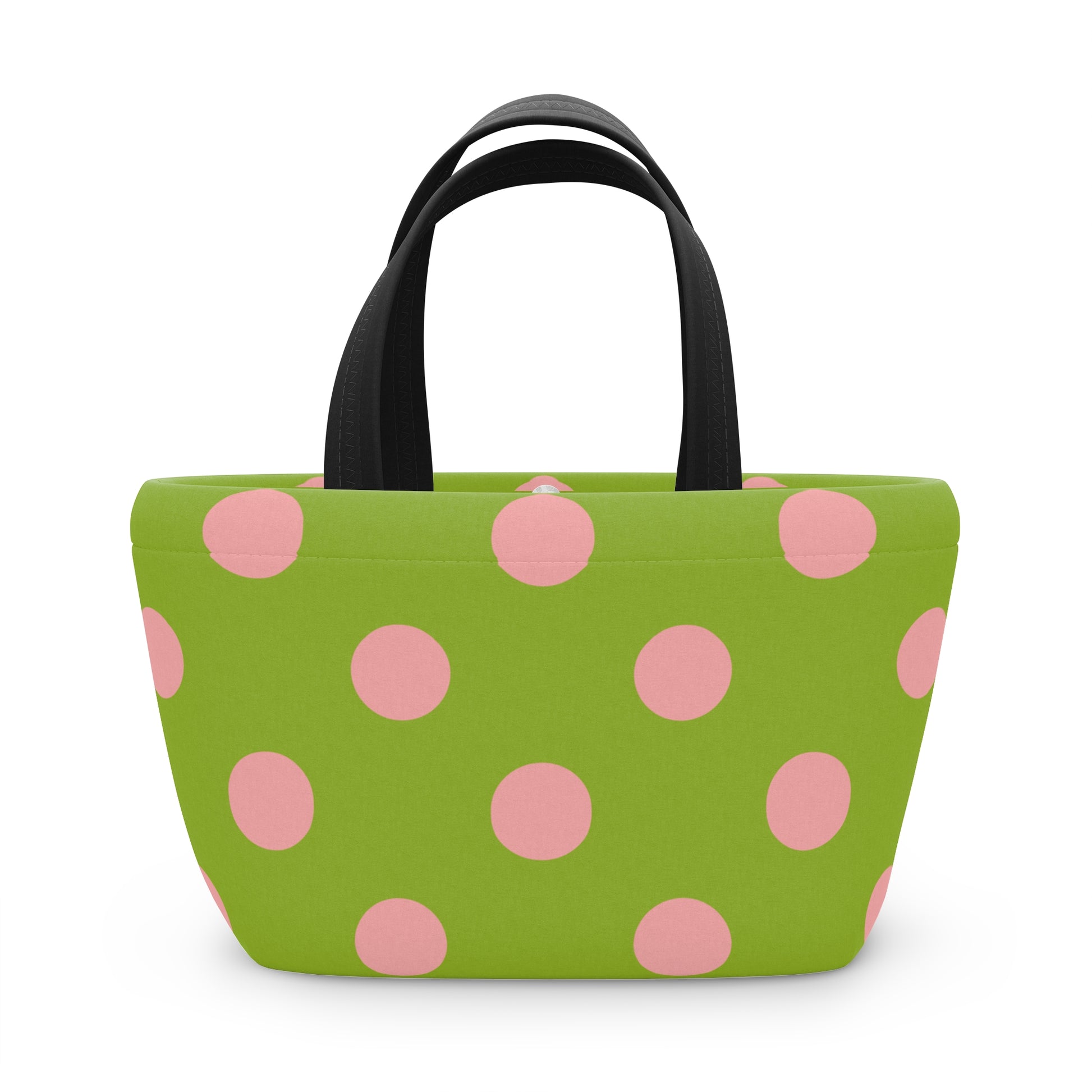 Green tote bag with pink polka dots on a white background