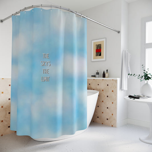 Shower curtain with blue gradient and 'The Sky's The Limit' text in a bathroom setting.