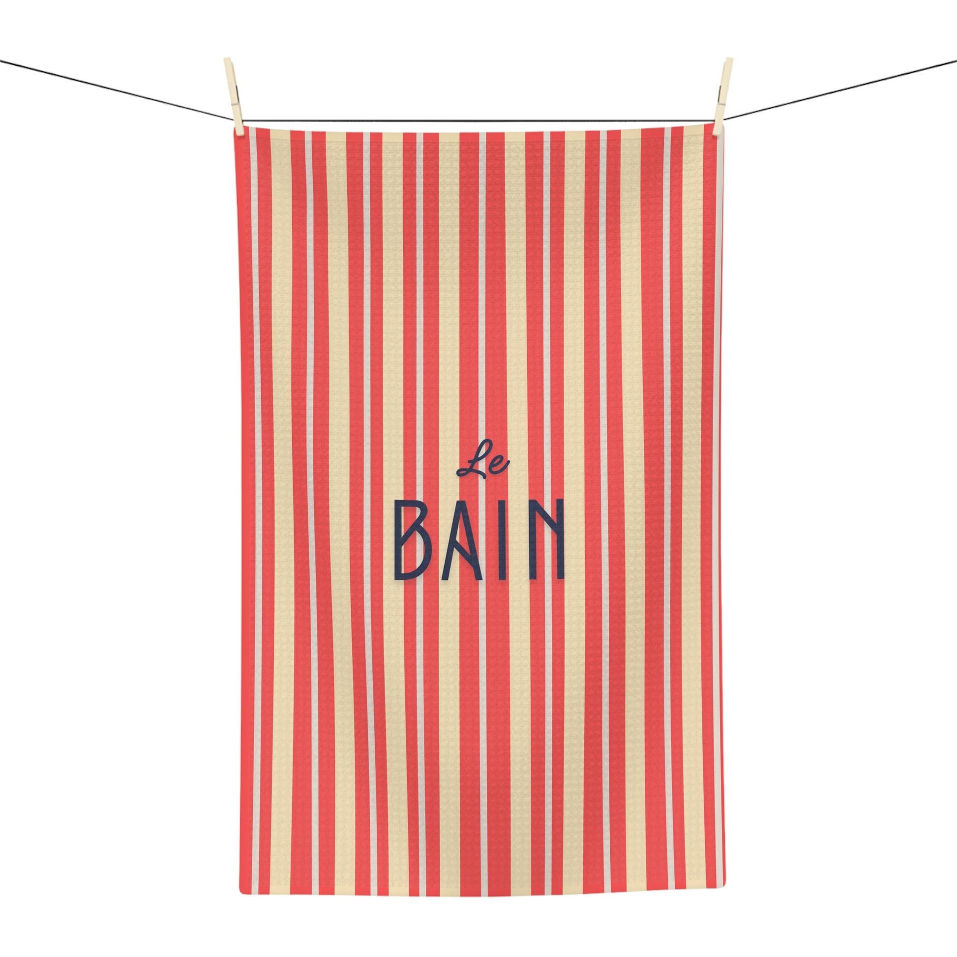 Striped towel with 'Le Bain' text on a white background