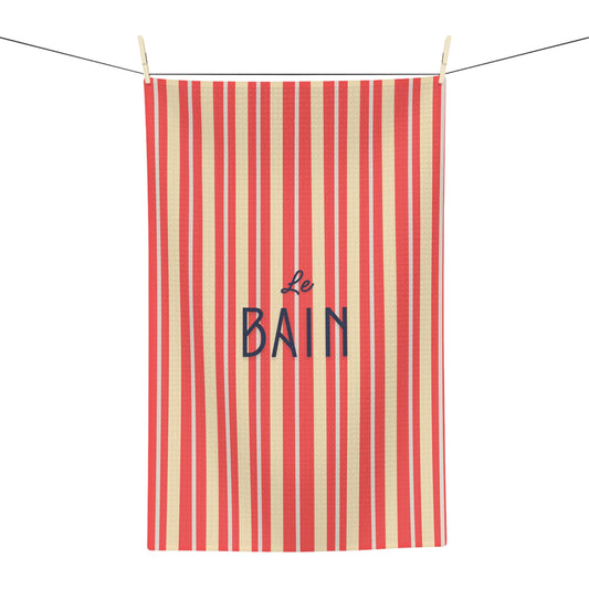 Striped towel with 'Le Bain' text on a white background