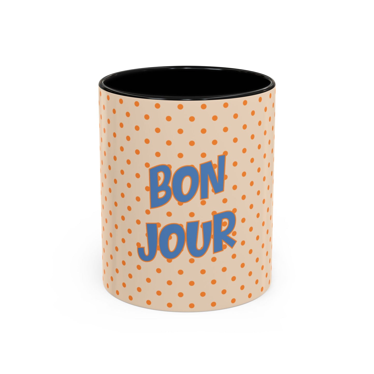 Mug with polka dot pattern and 'Bonjour' text on a white background