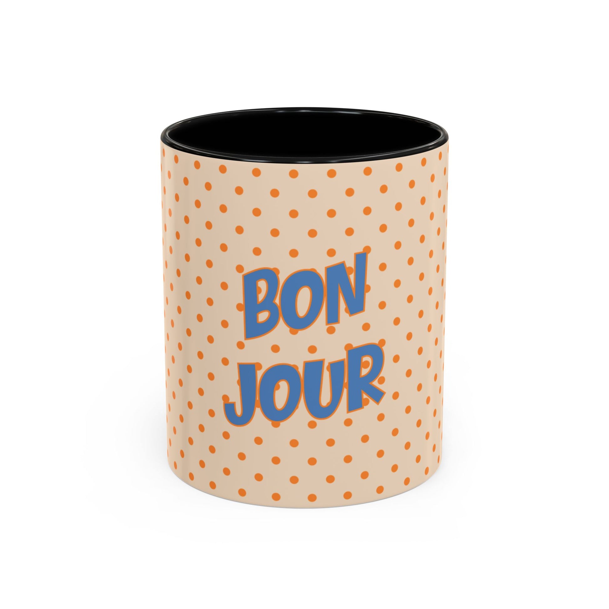 Mug with polka dot pattern and 'Bonjour' text on a white background