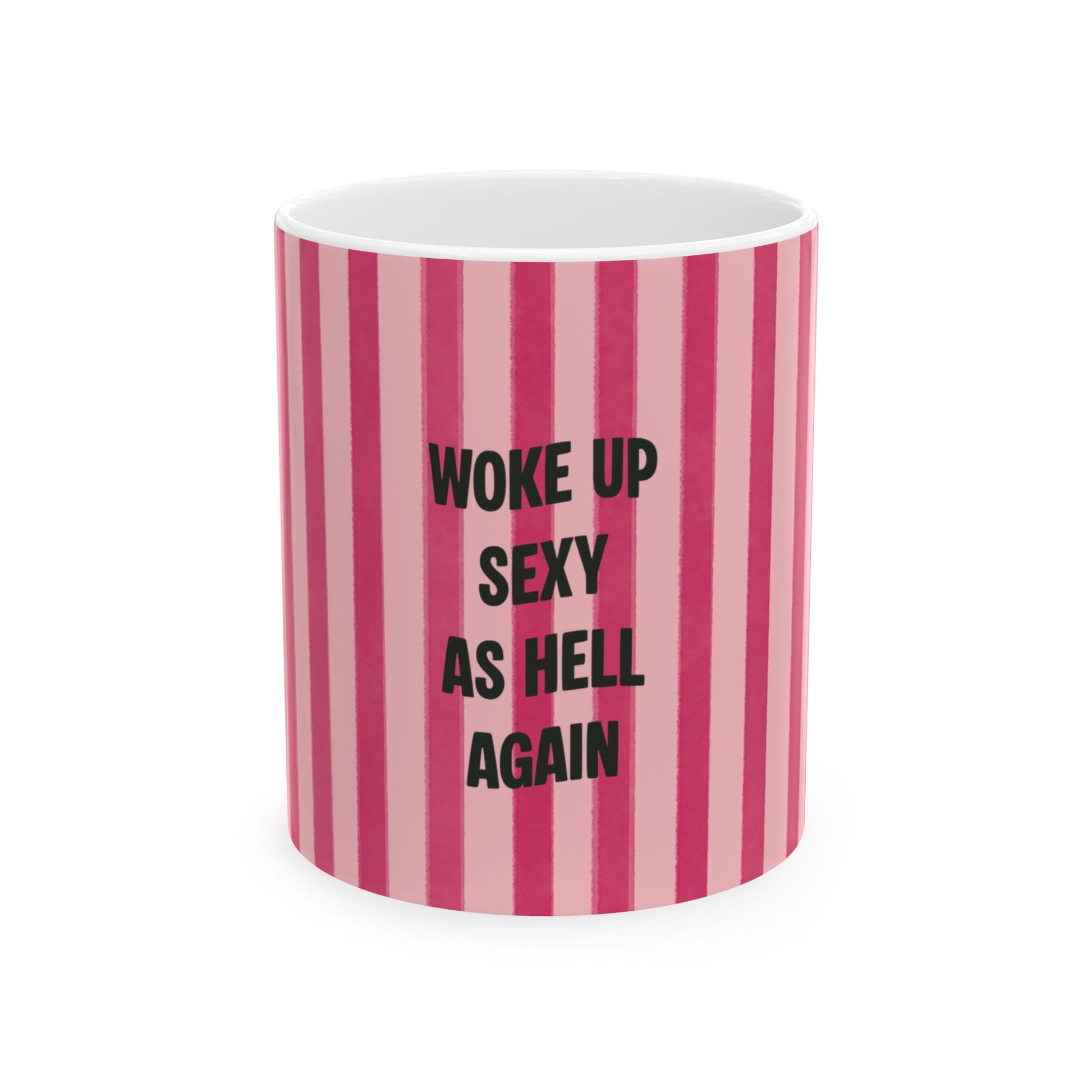 Mug with pink and white striped pattern and text 'Woke up sexy as hell again' on a white background
