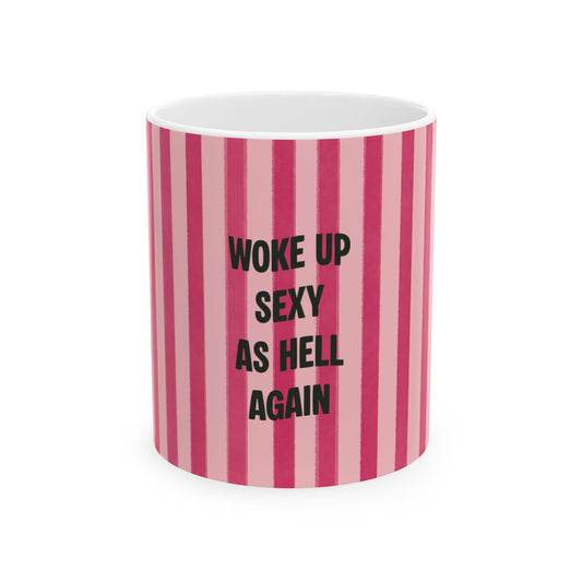 Mug with pink and white striped pattern and text 'Woke up sexy as hell again' on a white background