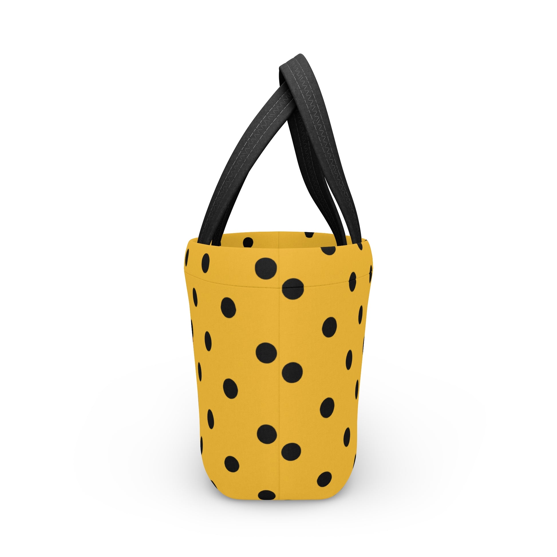 Yellow bucket with black polka dots and black handles on a white background