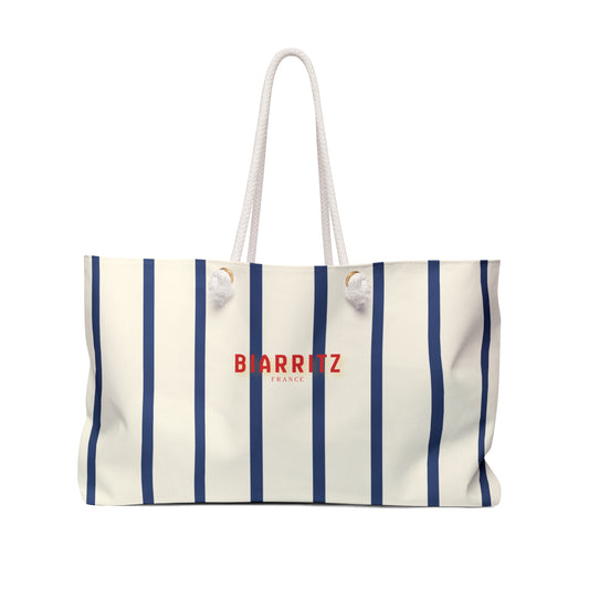 Striped tote bag with 'BIARRITZ FRANCE' text on a white background