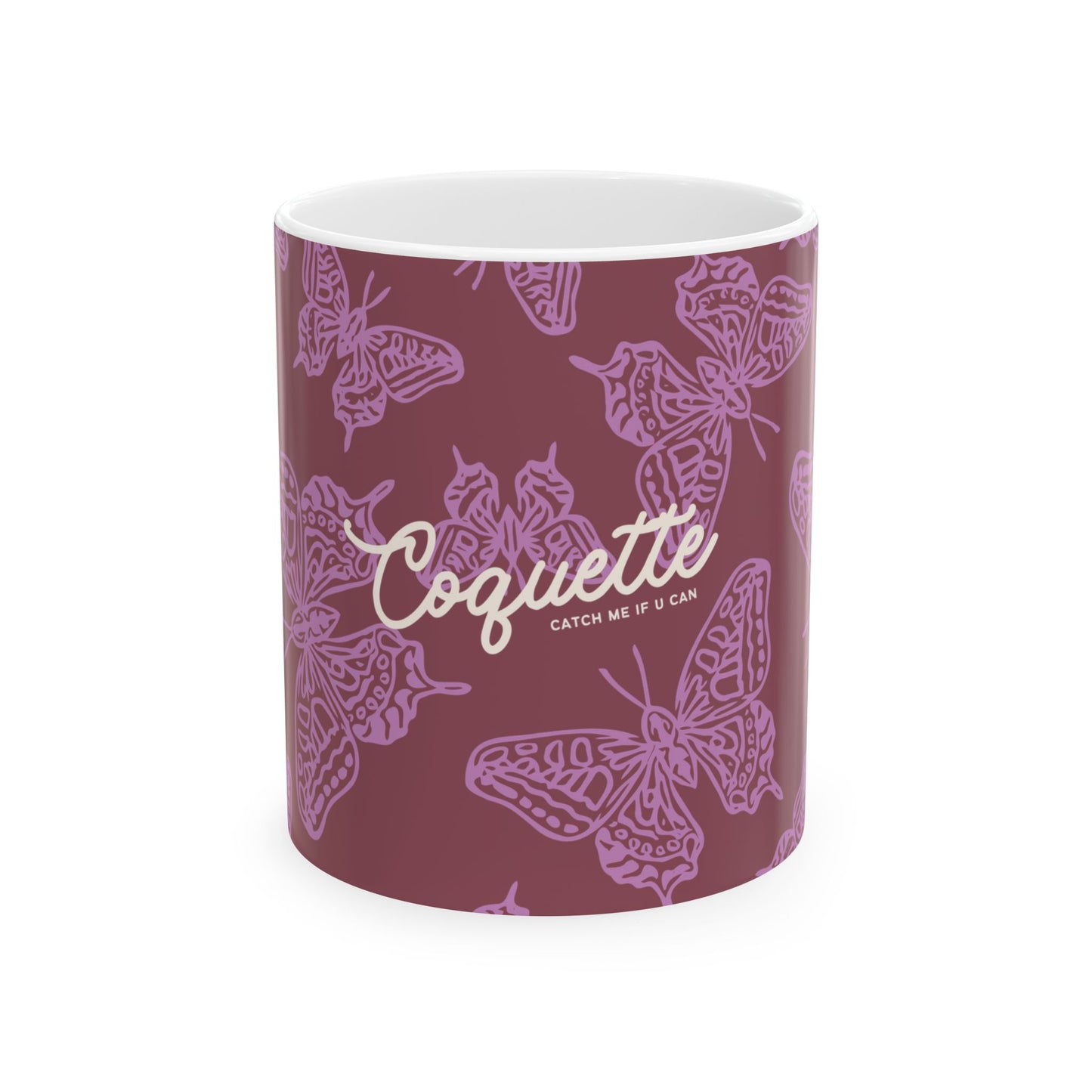 Mug with butterfly pattern and 'Coquette' branding on a white background
