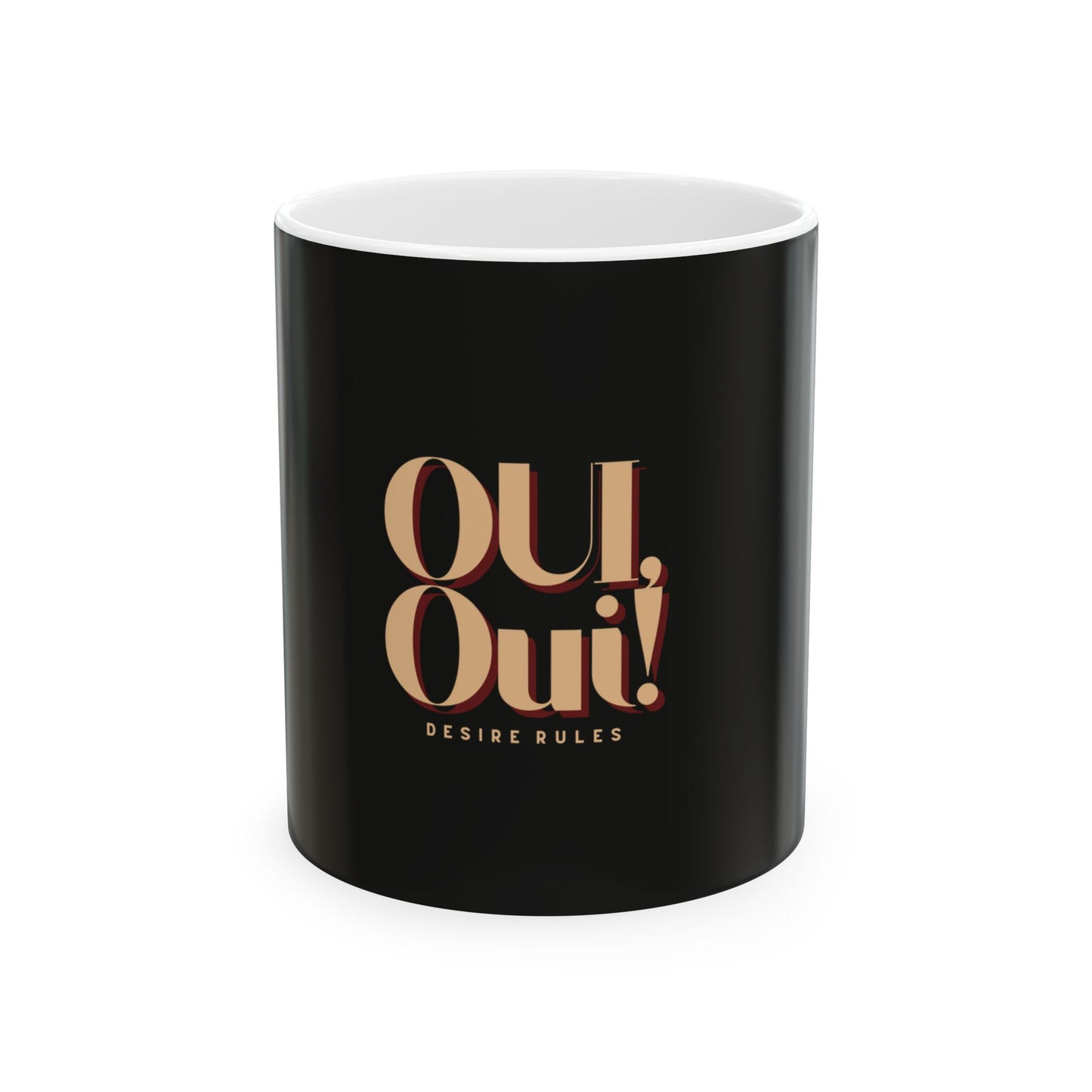 Black mug with 'Oui, Oui! Desire Rules' text on a white background