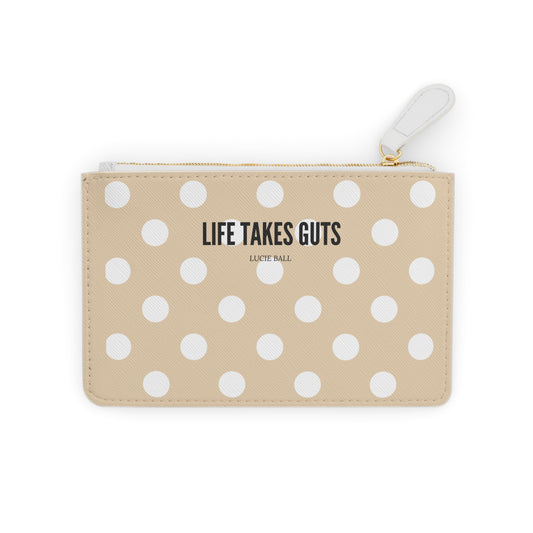 Beige pouch with white polka dots and 'Life Takes Guts' text on a white background