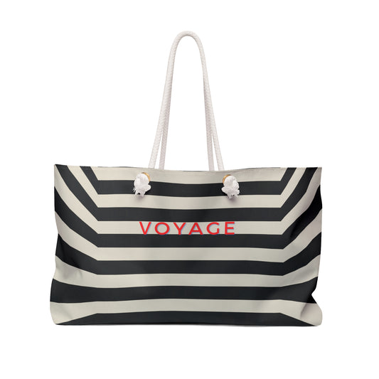 Black and white striped tote bag with 'VOYAGE' text on a white background