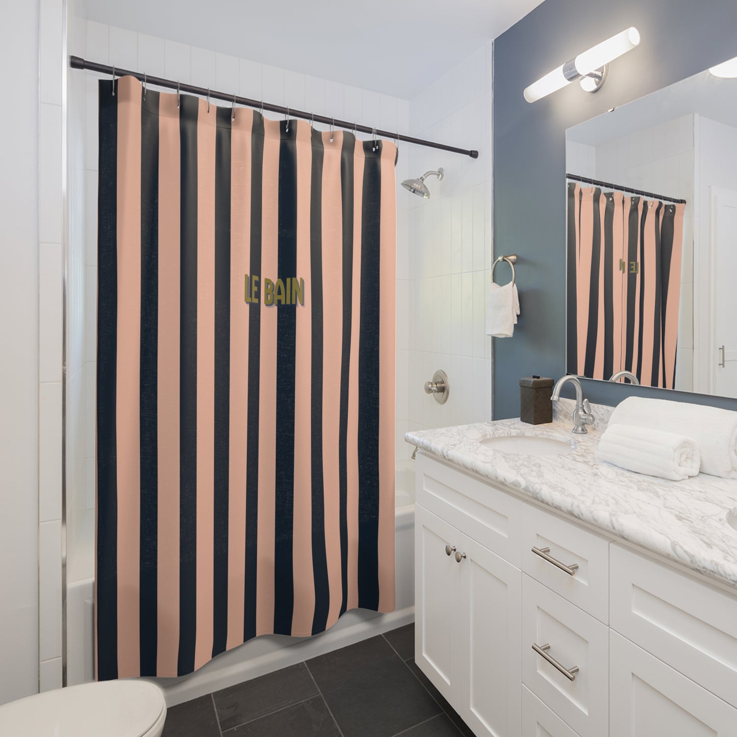 Bathroom with a colorful shower curtain, white vanity, and mirror.