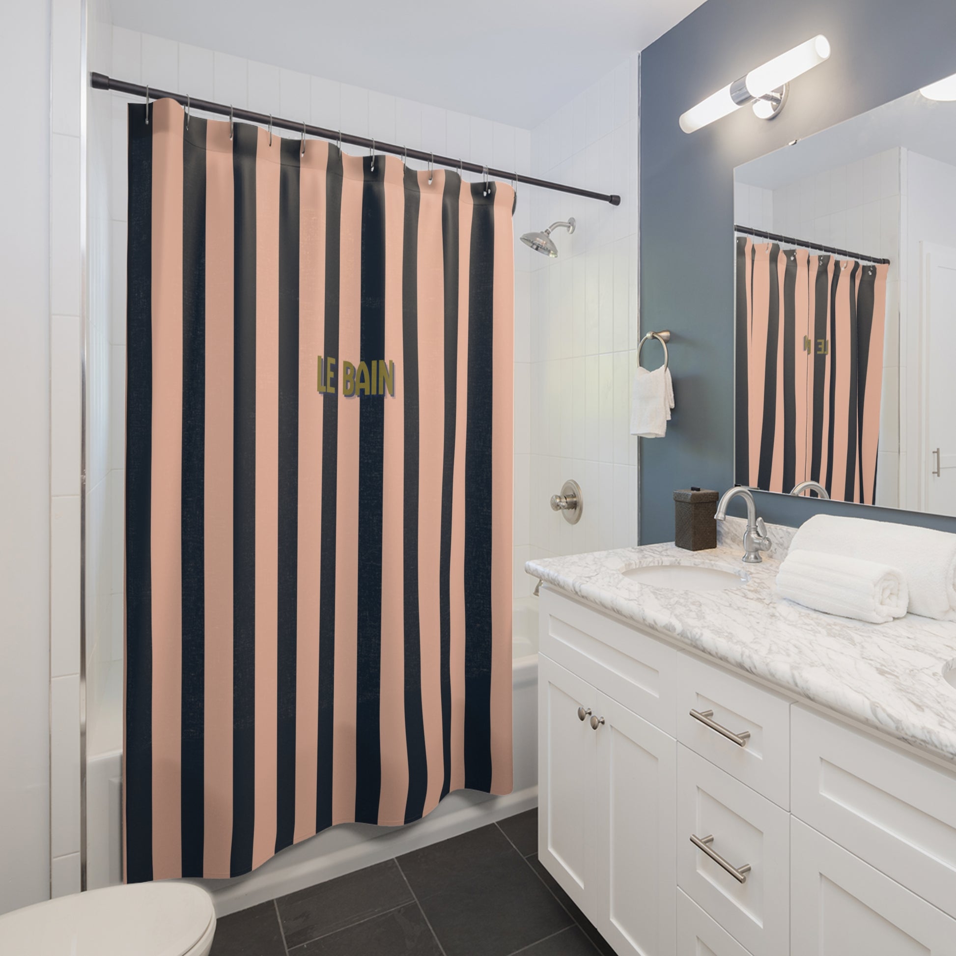 Bathroom with a colorful shower curtain, white vanity, and mirror.