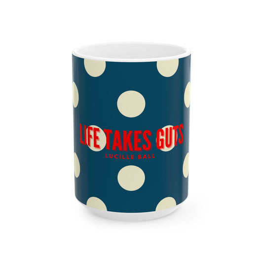 Mug with 'Life Takes Guts' text on a blue background with white polka dots