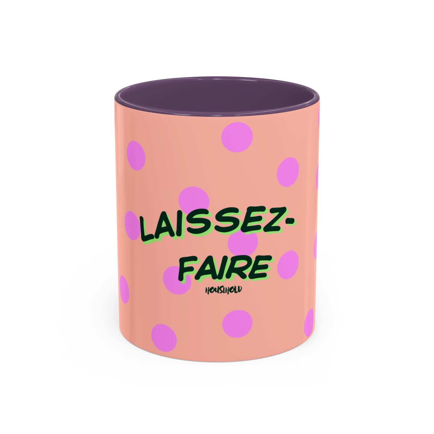 Pink polka dot mug with green text on a white background