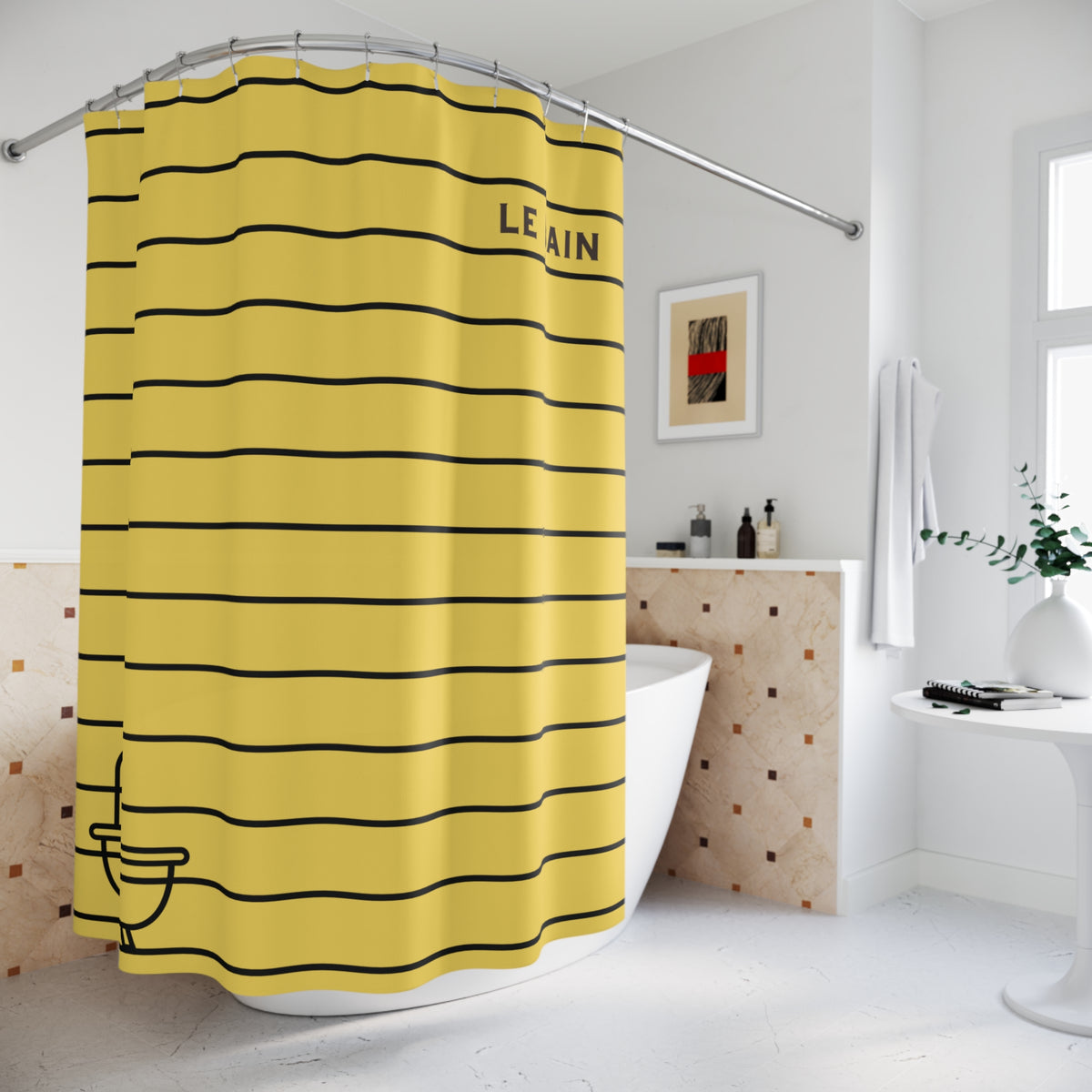 A yellow shower curtain with black horizontal stripes and the word 'LEAIN' printed near the top, hanging in a bright white bathroom next to a bathtub.
