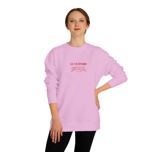 Person wearing a pink Le Guepard sweatshirt with text on a white background