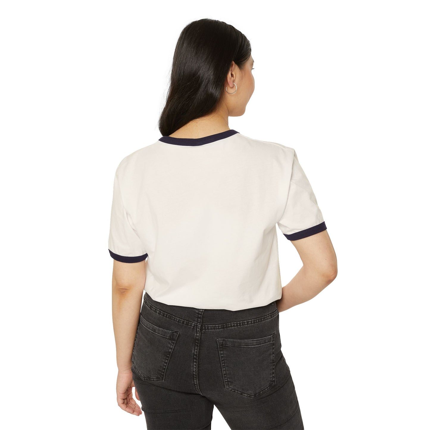Woman wearing a white t-shirt with navy trim and black pants on a white background