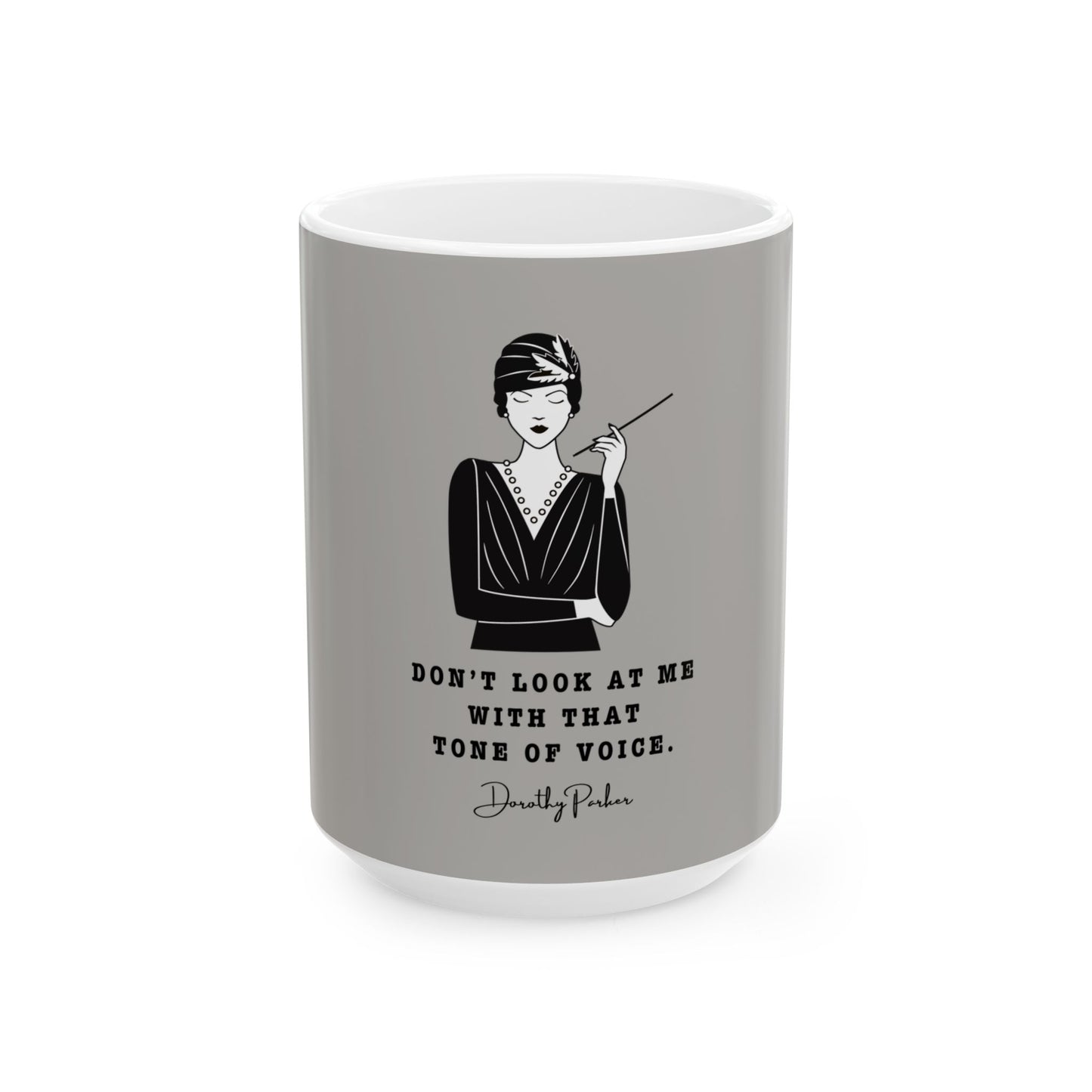 Gray mug with a black and white illustration of a woman and a quote on a white background