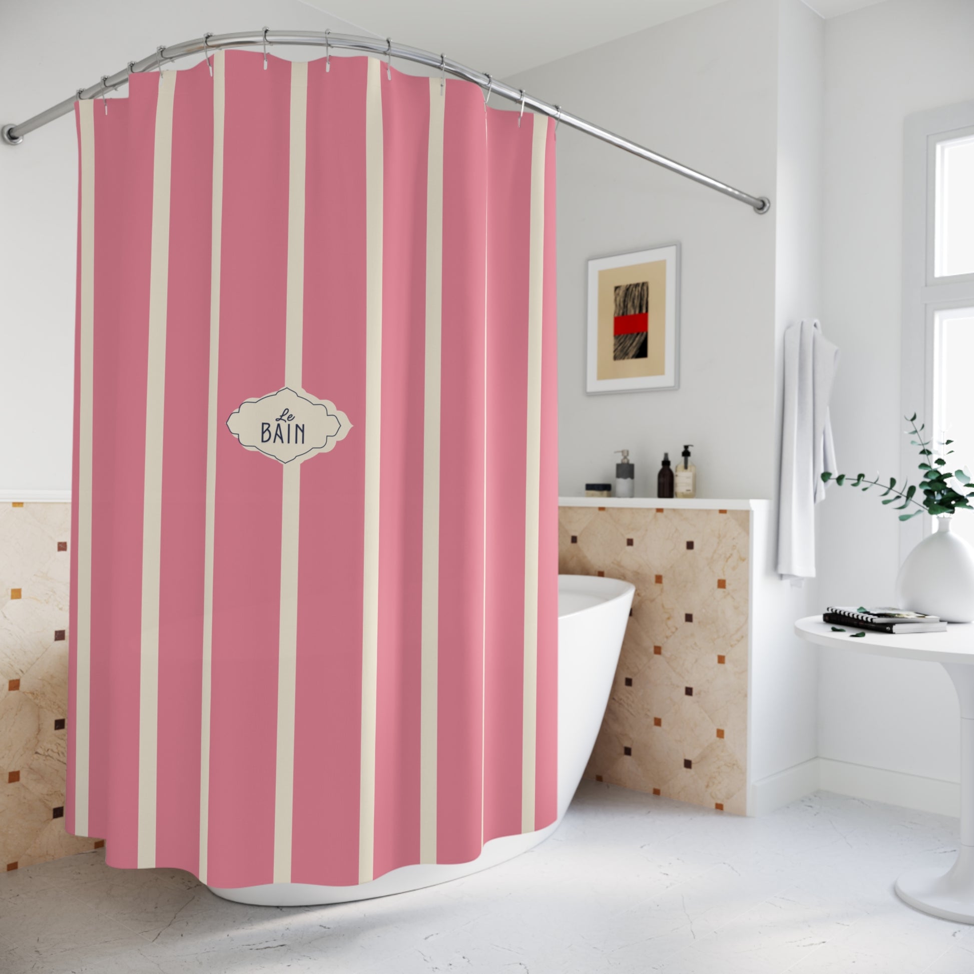 Pink and off-white vertically striped shower curtain with a central decorative label reading 'BATH', shown hanging in a bright bathroom setting.