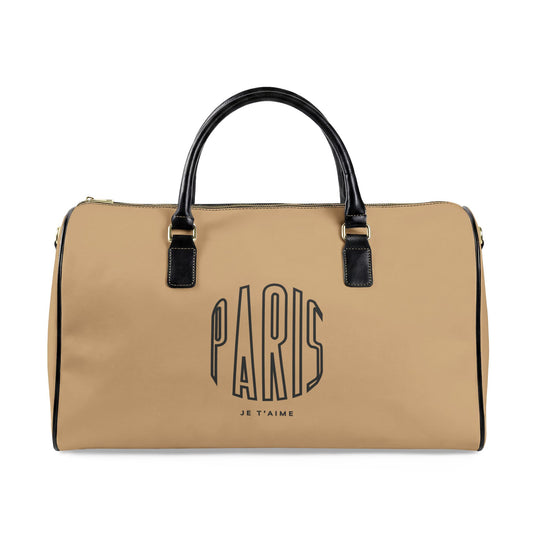 Beige duffel bag with 'PARIS JE T'AIME' text on a white background