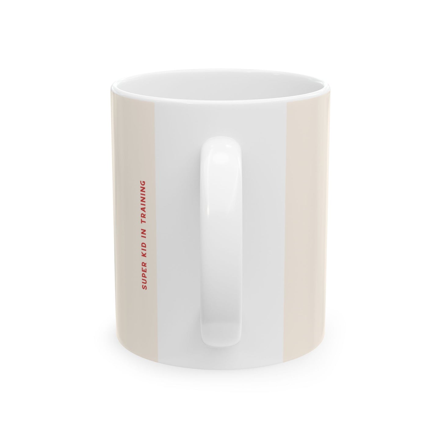 A white ceramic mug with a vertical beige stripe on the left side and red text reading 'SUPER KID IN TRAINING' printed along the edge, shown on a plain white background.