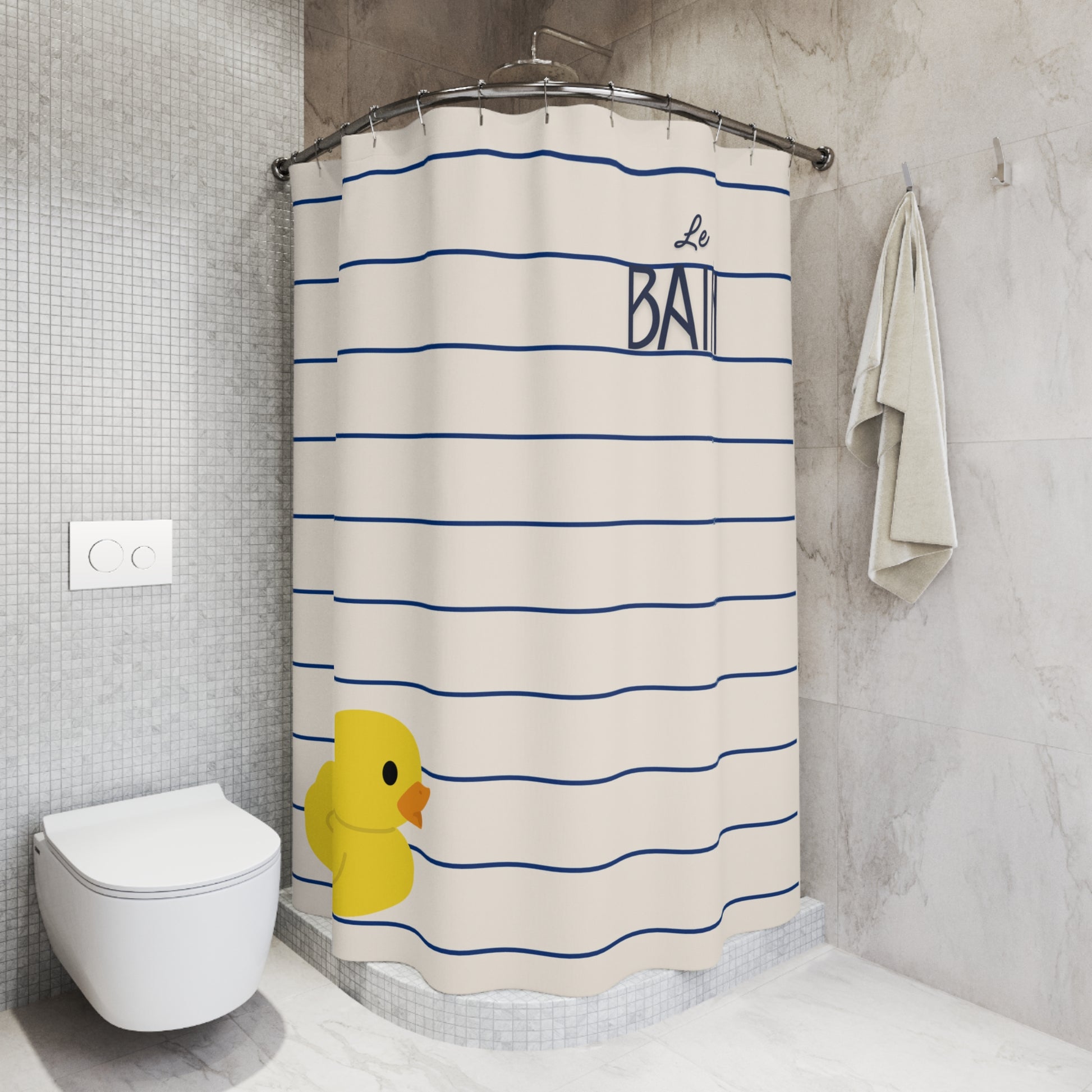 Shower curtain with blue stripes and a yellow rubber duck design in a bathroom.