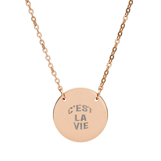 Rose gold necklace with a round pendant engraved with 'C'EST LA VIE' on a white background