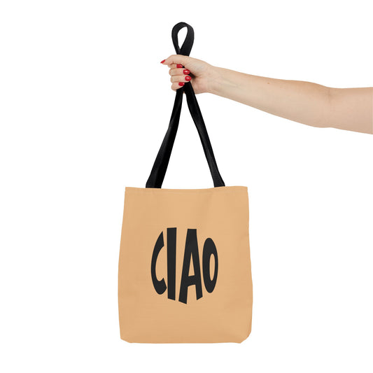 Tan tote bag with 'CIAO' text held by a hand on a white background