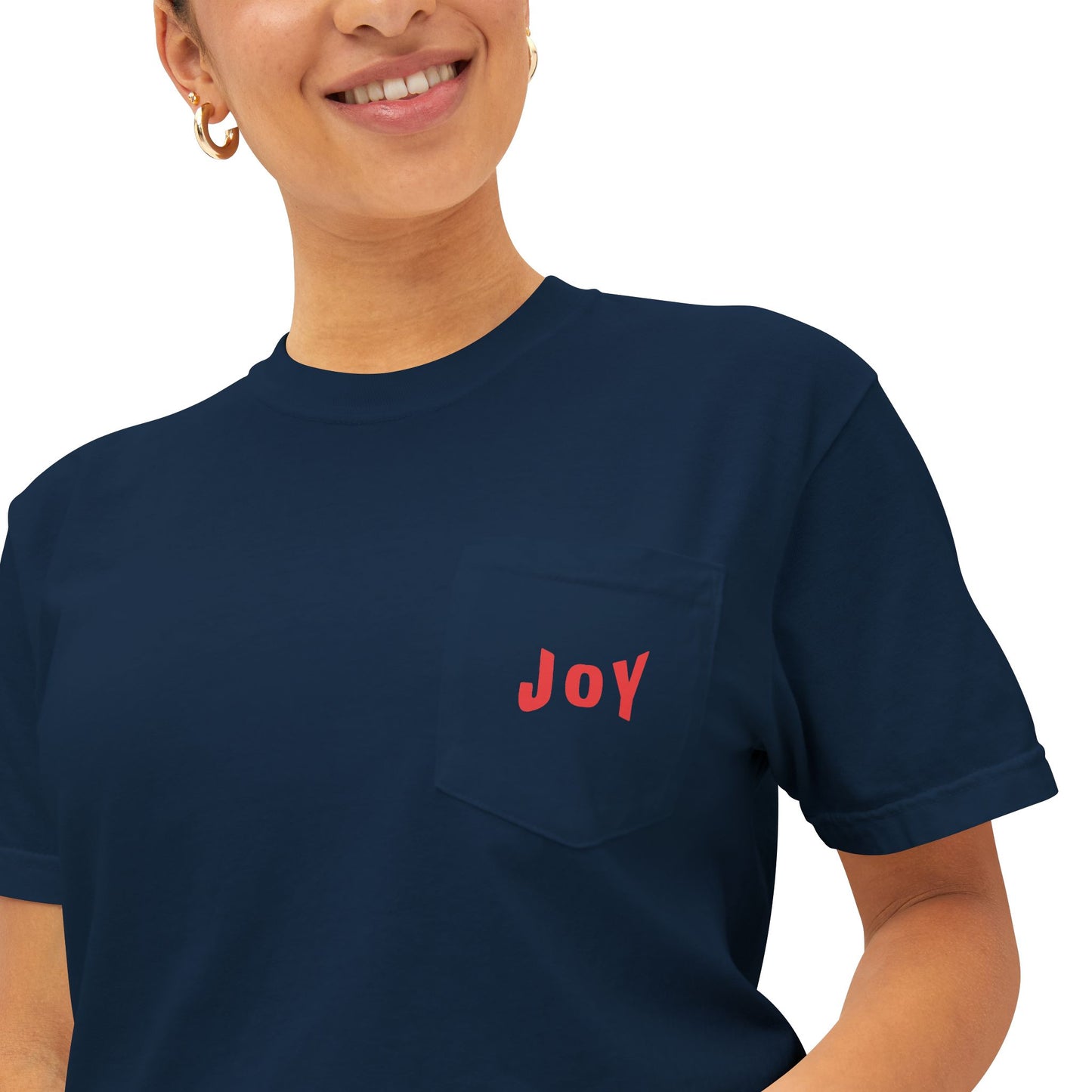Person wearing a navy blue t-shirt with 'JOY' in red on a white background