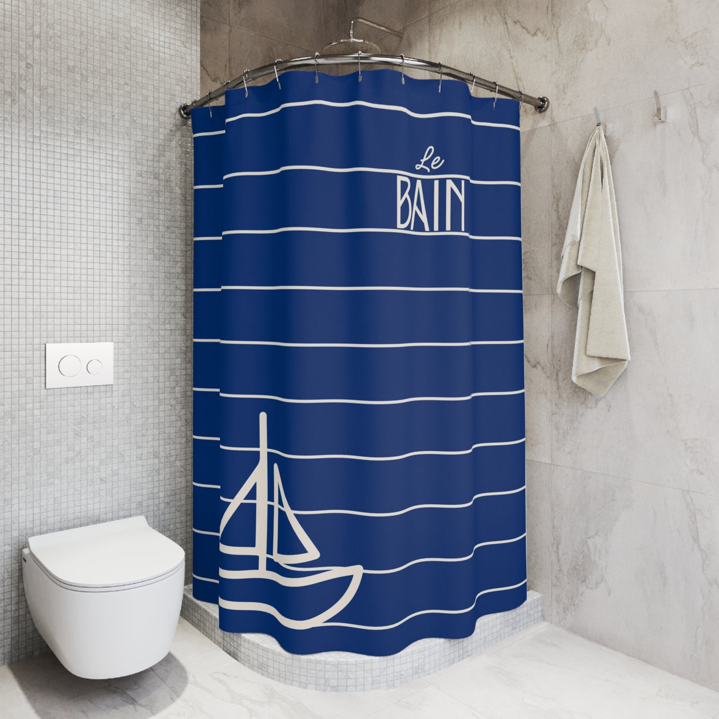 Blue and white striped shower curtain with sailboat design and 'Le Bain' text in a bathroom.