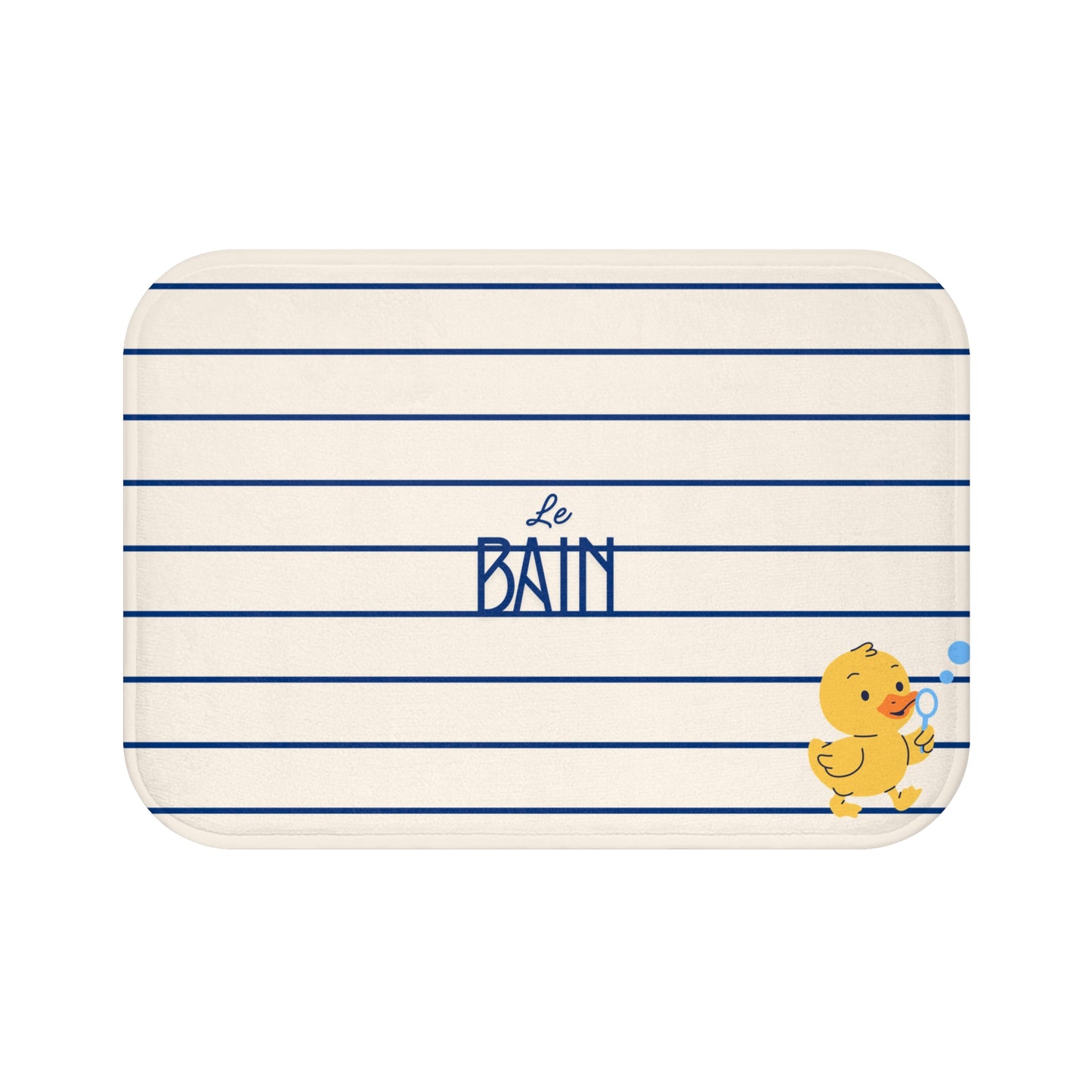 A rectangular bath mat with rounded corners, featuring a cream background with horizontal navy blue stripes, the French text 'Le Bain' in navy in the center, and a small yellow duckling illustration in the bottom right corner.