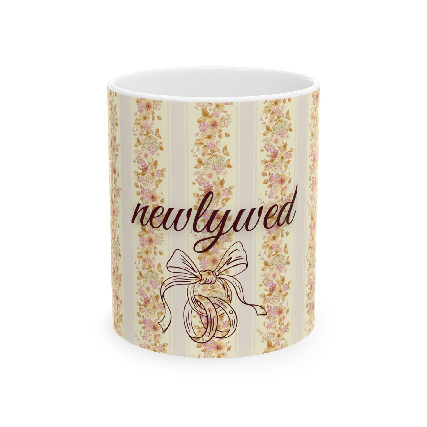 Mug with floral design and 'newlywed' text on a white background