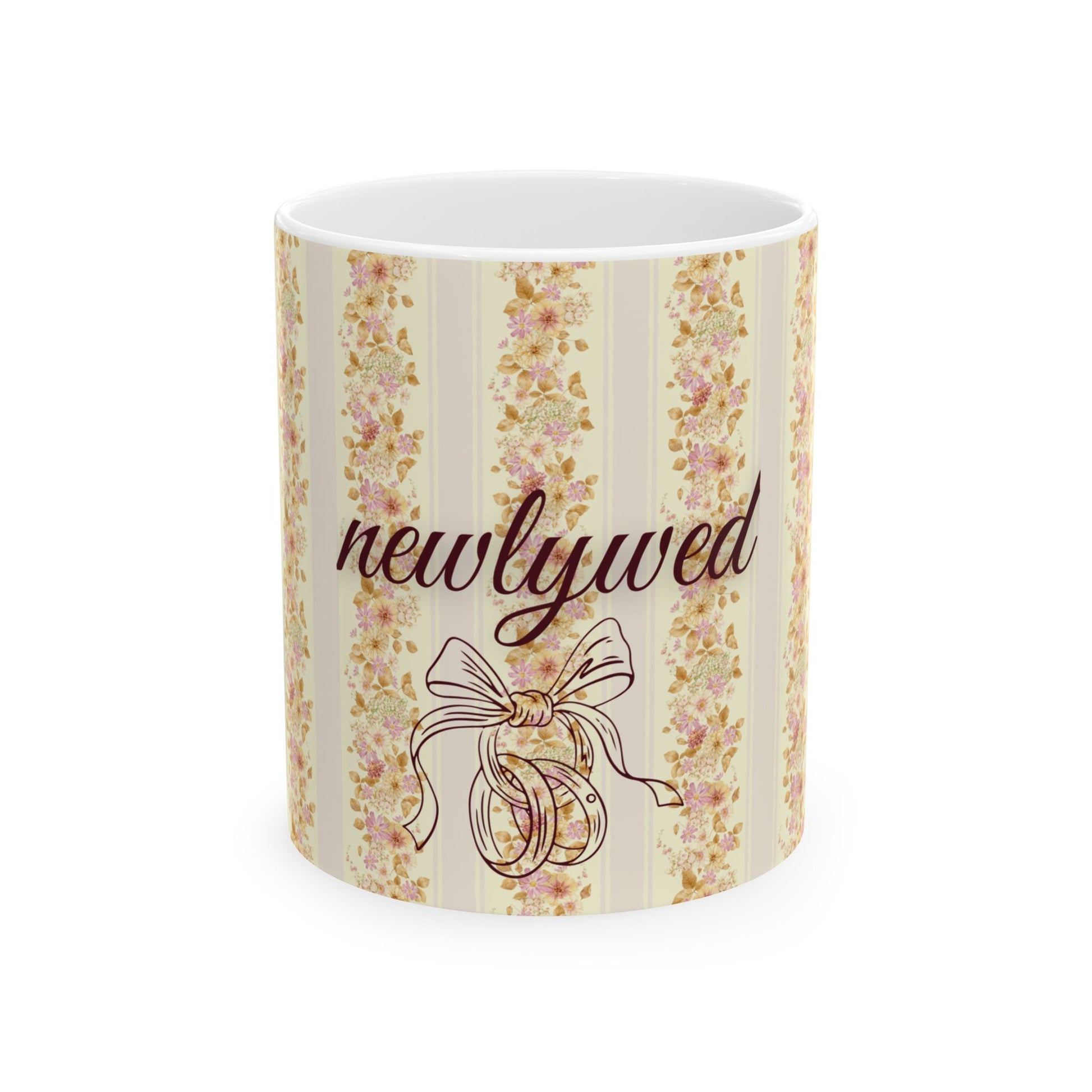 Mug with floral design and 'newlywed' text on a white background