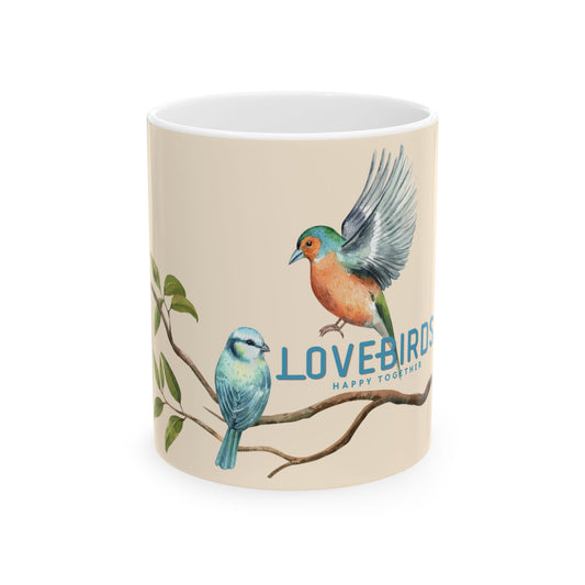 A white ceramic mug featuring a vintage-style illustration of two lovebirds on a branch against a warm beige background, with the text 'LOVEBIRDS HAPPY TOGETHER'.
