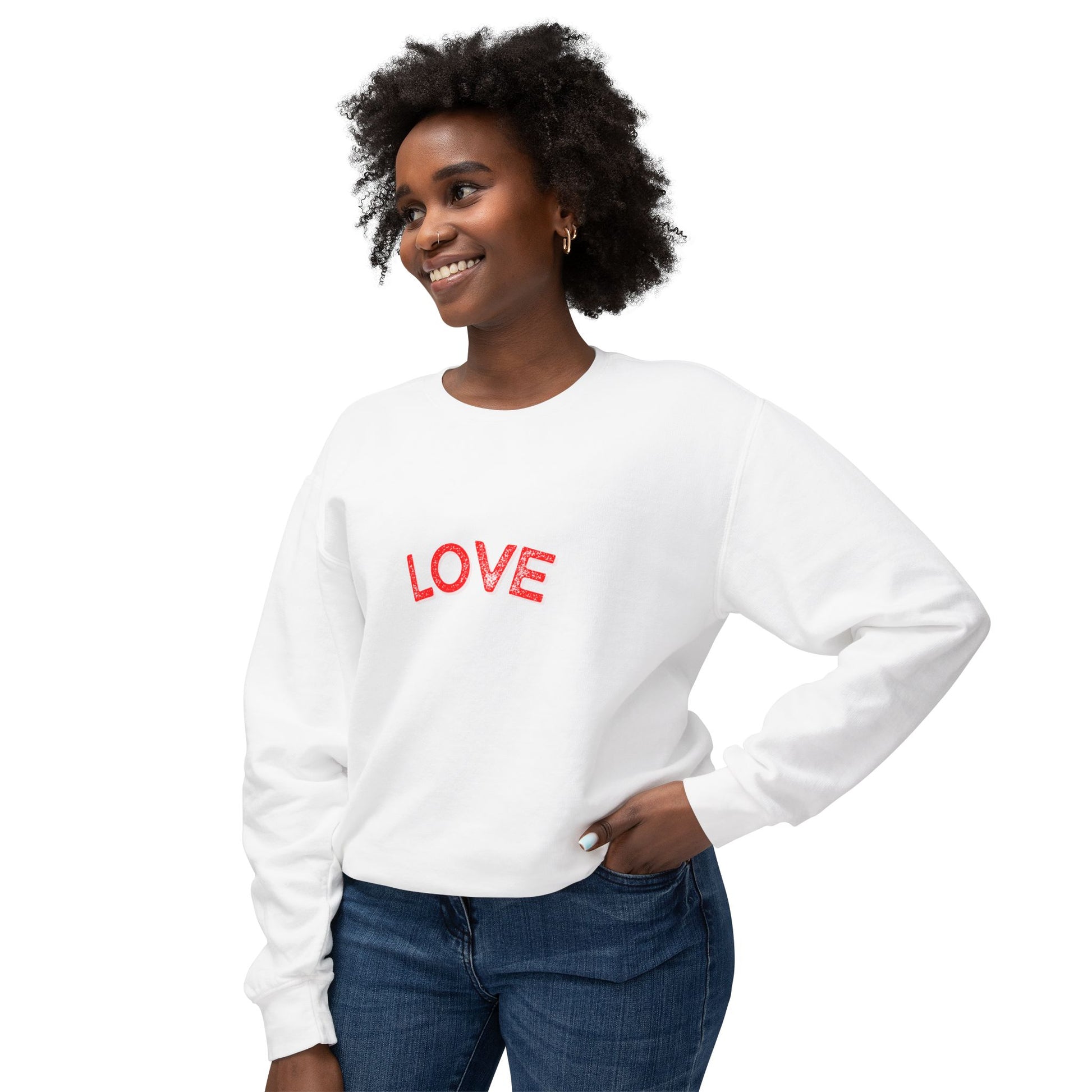 Woman wearing a white sweatshirt with 'LOVE' printed in red on a white background