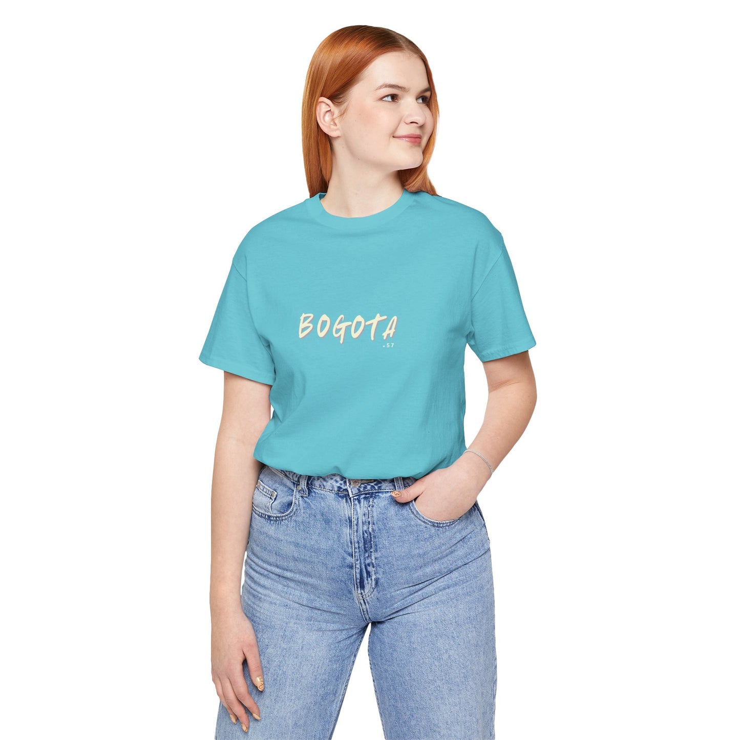 Person wearing a turquoise t-shirt with 'BOGOTA' text on a white background