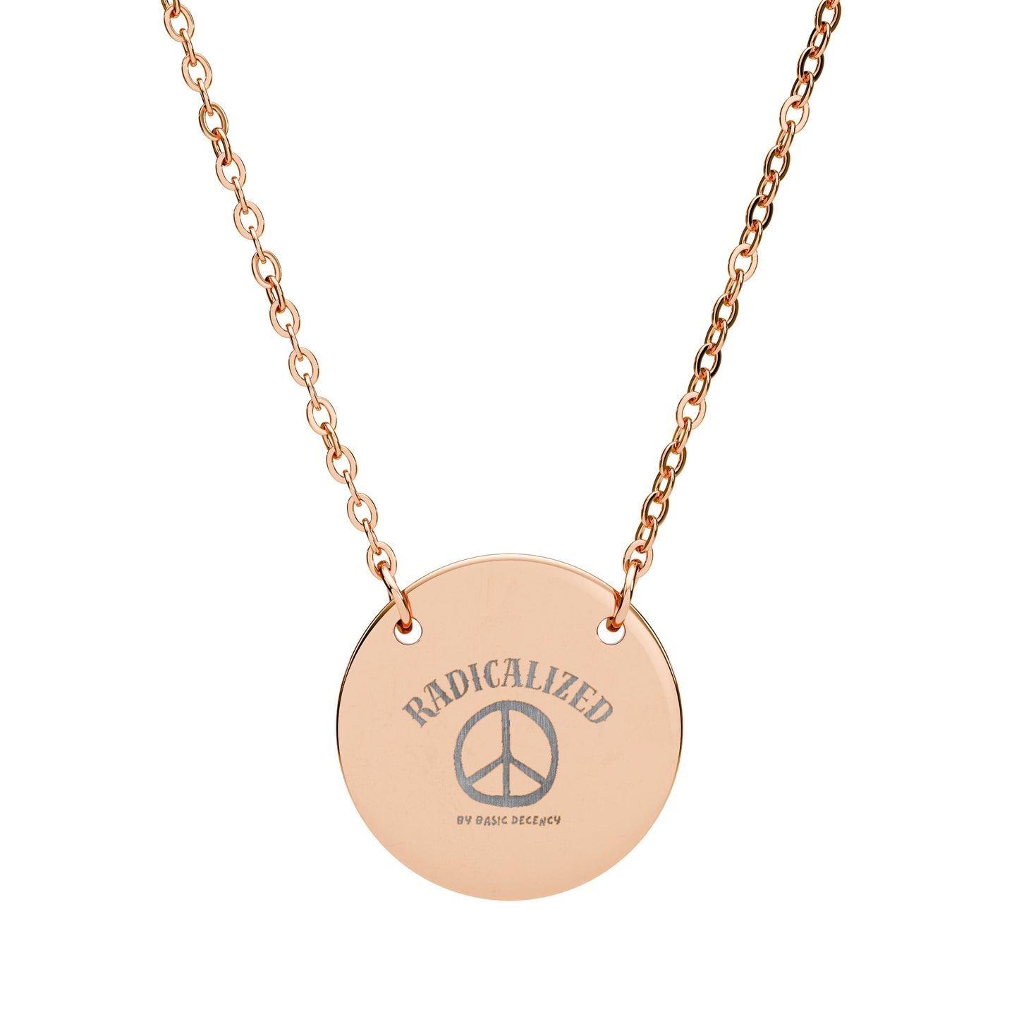 Rose gold necklace with a round pendant featuring 'RADICALIZED' and a peace symbol.
