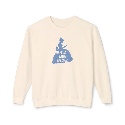 An off-white crewneck sweatshirt featuring a blue graphic of a woman in a dress reading, with the text 'HAPPIEST WHEN READING' printed on the front, displayed against a solid white background.