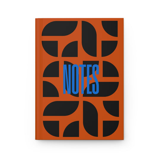 Notebook with orange cover featuring black abstract shapes and blue 'NOTES' text on a white background