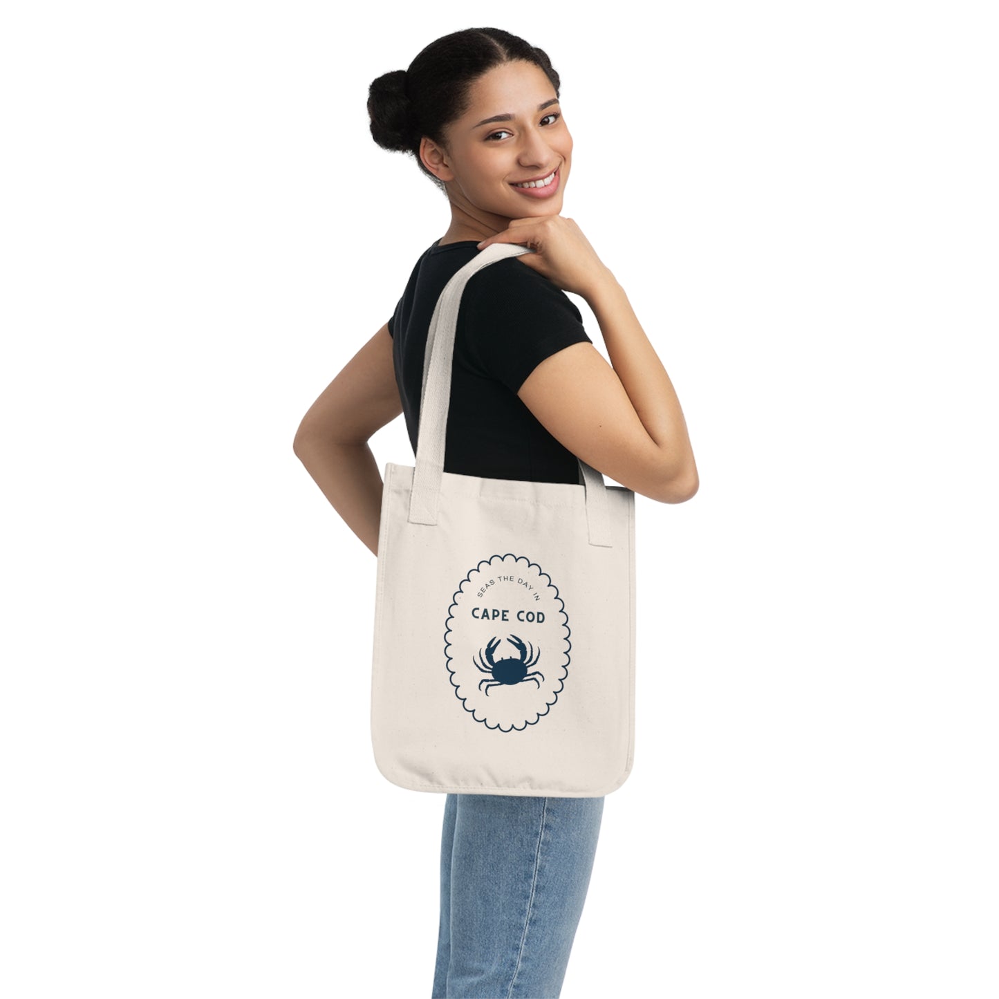 Woman holding a tote bag with 'Cape Cod' design on a white background