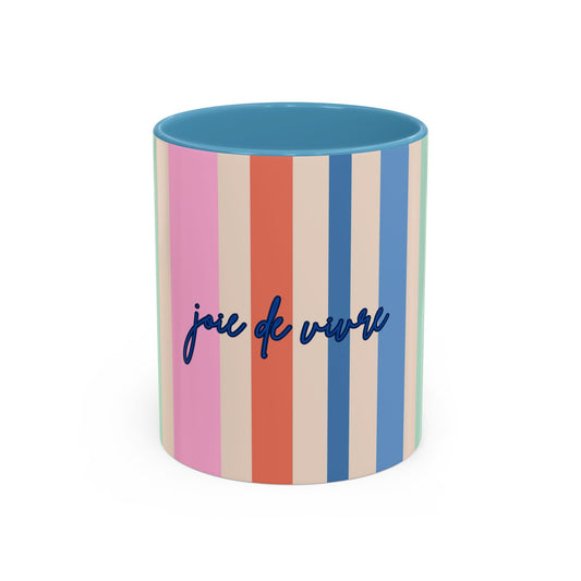 Colorful striped mug with 'joie de vivre' text on a white background