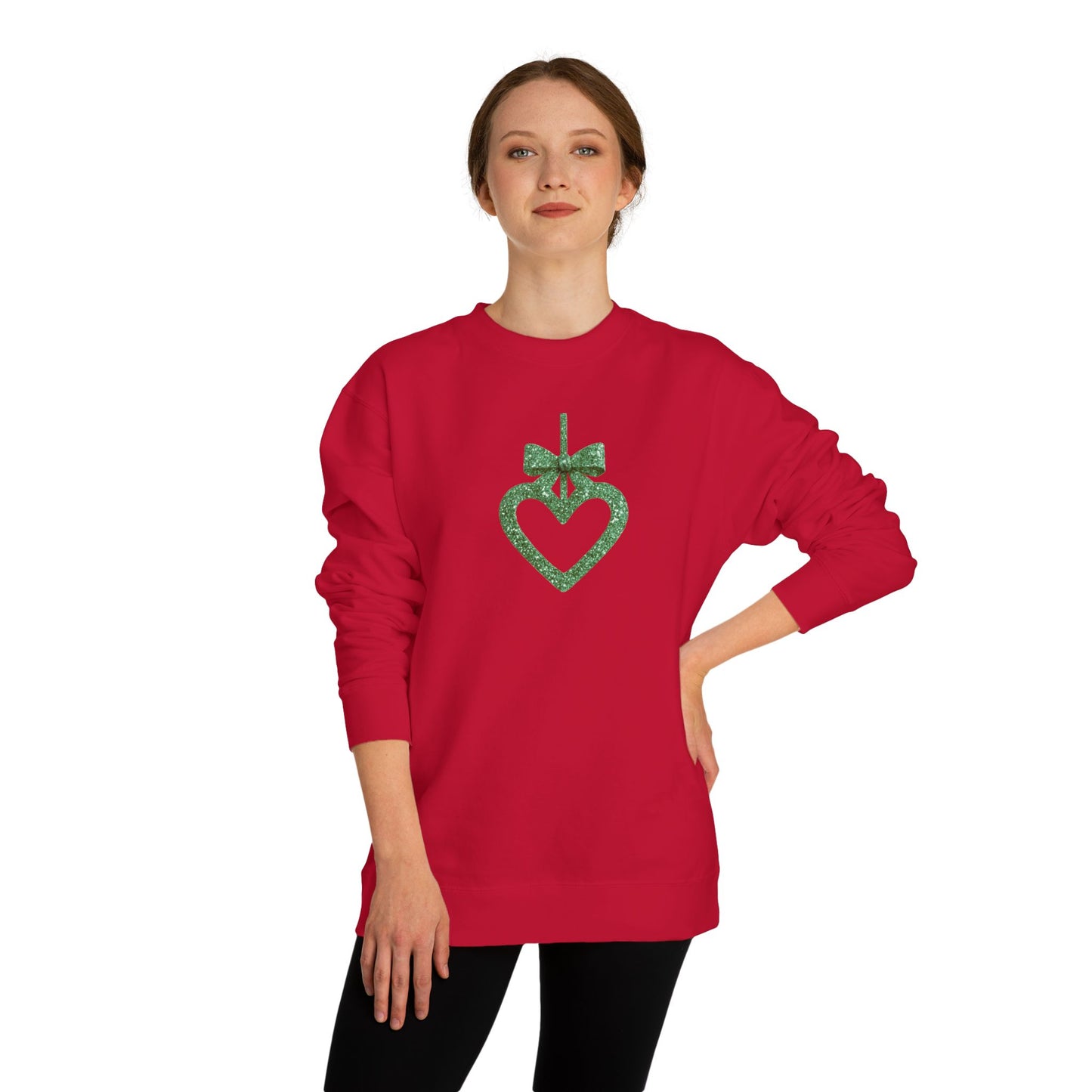 Red sweatshirt with a green heart design worn by a person on a white background