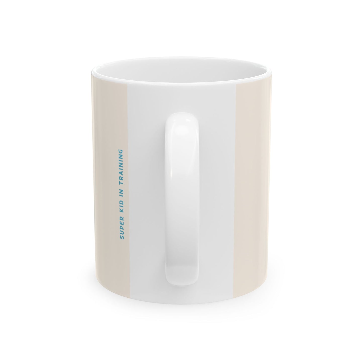 A white ceramic mug with a vertical beige stripe on the left side and blue text reading 'SUPER KID IN TRAINING' printed on it, shown against a plain white background.